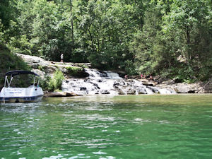 Families enjoying a waterfall on Lake Keowee.